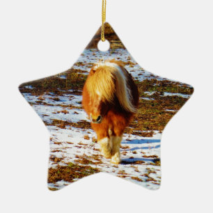 Brown and cream miniature horse in the snow. ceramic ornament