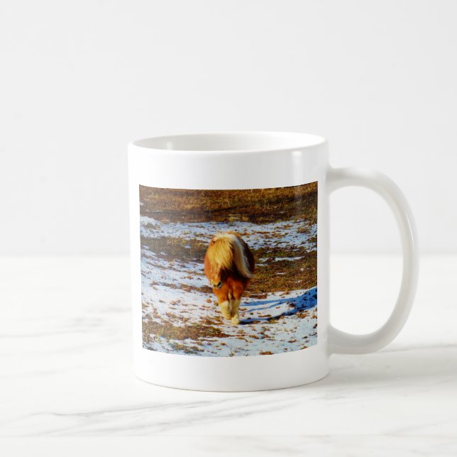 Brown and cream miniature horse in the snow. coffee mug (Right)