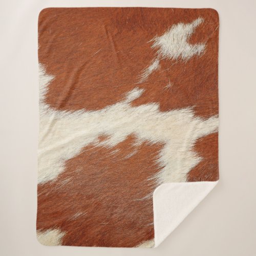 Brown and white cowhide texture sherpa blanket