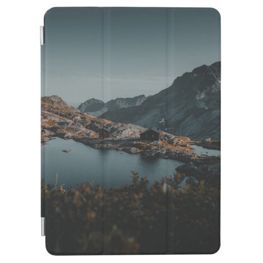 BROWN AND WHITE MOUNTAINS NEAR BODY OF WATER DURIN iPad AIR COVER