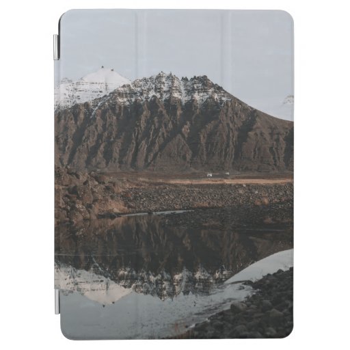 BROWN AND WHITE MOUNTAINS NEAR LAKE DURING DAYTIME iPad AIR COVER