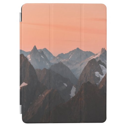 BROWN AND WHITE MOUNTAINS UNDER ORANGE SKY iPad AIR COVER
