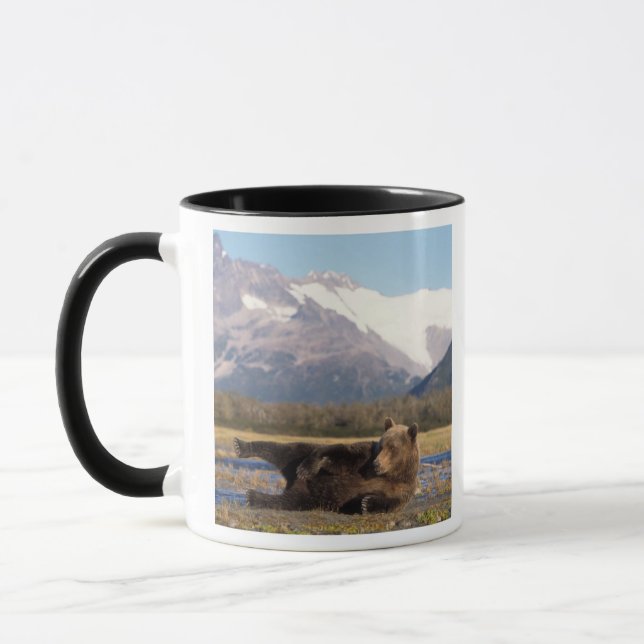 Brown bear, grizzly bear stretching on its back mug (Left)