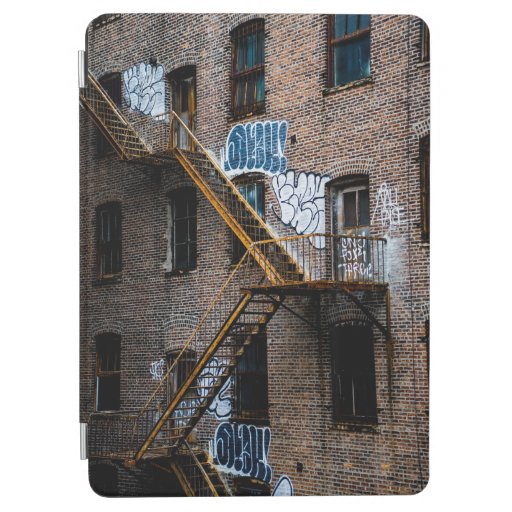 BROWN BRICK BUILDING WITH YELLOW METAL LADDER iPad AIR COVER