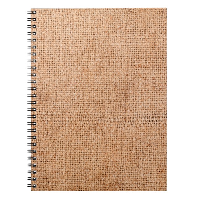 Brown burlap laying on white sheet. Abstract backg Notebook (Front)