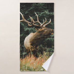 BROWN DEER ON GREEN GRASS DURING DAYTIME BATH TOWEL