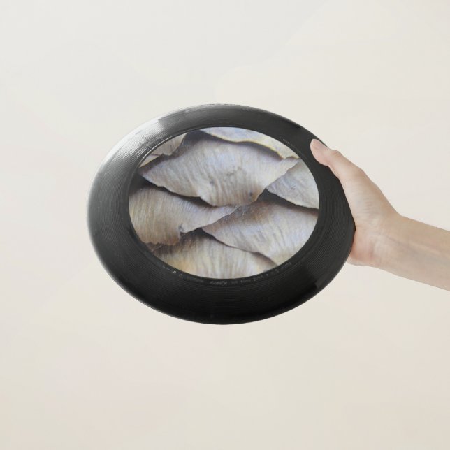 Brown fir cone pattern Wham-O frisbee (In Hand)