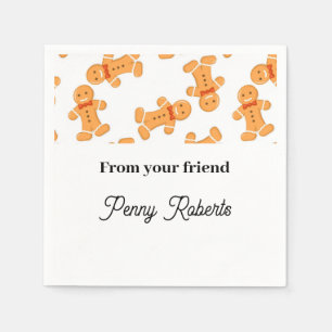 Brown gingerbread man on white napkins