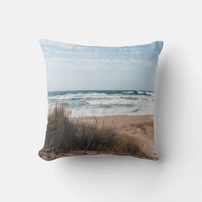 BROWN GRASS NEAR SEA UNDER BLUE SKY THROW PILLOW (Front)