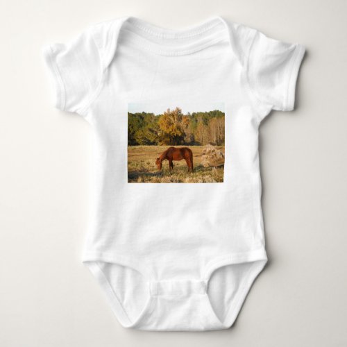 Brown horse in  yellow tree field baby bodysuit