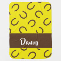 Brown horseshoes on yellow baby blanket
