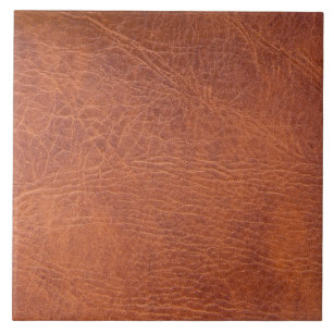 A brown leather textured material that tiles seamlessly as a pattern, Stock image