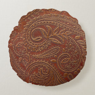 Brown leather, tooled floral pattern. round pillow