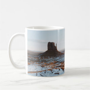 BROWN ROCK FORMATION ON WHITE SNOW COVERED GROUND COFFEE MUG