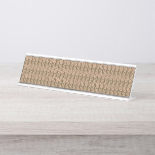 Brown rug featuring a detailed motif pattern with desk name plate