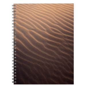 Brown sand with water in the morning notebook
