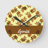 Brown sitting cats on yellow round clock
