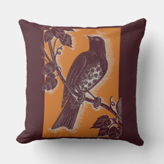 brown thrush with orange throw pillow