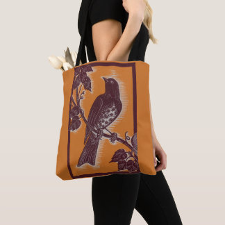 brown thrush with orange tote bag