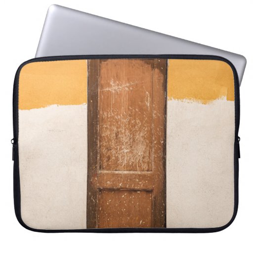 BROWN WOODEN DOOR ON WHITE SNOW COVERED GROUND LAPTOP SLEEVE