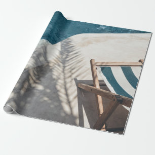 Brown wooden lounger near body of water wrapping paper
