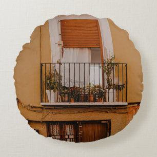BROWN WOODEN WINDOW FRAME WITH GREEN PLANTS ROUND PILLOW