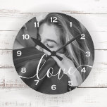 Brush Script Love Custom Photo Keepsake Round Clock<br><div class="desc">This keepsake clock features your favorite photo with the word 'Love' overlaid in a romantic white decortive brush script.  Order for yourself or as a special gift for someone you love.</div>