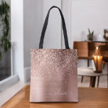 Brushed Metal Rose Gold Pink Glitter Monogram Tote Bag<br><div class="desc">Pink Rose Gold and Blush Pink Faux Sparkle and Dripping Glitter Metallic Stainless Steel Foil Elegant Monogram Book Bag. This Book Bag can be customized to include your initial and first name and given as a gift for Christmas,  Sweet 16 Birthday,  Bridal Shower or a Wedding.</div>