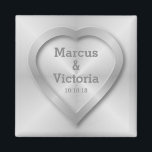 Brushed stainless steel wedding magnet<br><div class="desc">A wedding design for a modern wedding. This design has the look of brushed, polished steel or aluminum. There is a heart embossed on the design to look like pressed metal. The bride and grooms names can be edited to suit your needs. If you would like any help customizing this...</div>