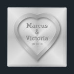 Brushed stainless steel wedding magnet<br><div class="desc">A wedding design for a modern wedding. This design has the look of brushed, polished steel or aluminum. There is a heart embossed on the design to look like pressed metal. The bride and grooms names can be edited to suit your needs. If you would like any help customizing this...</div>