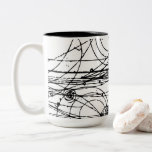 Bubble chamber tracks Two-Tone coffee mug<br><div class="desc">Charged particles tracks created in a bubble chamber.</div>