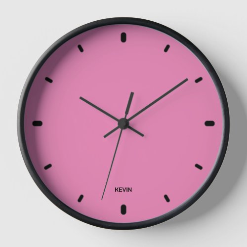 Bubble gum pink clock face and black hours numbers