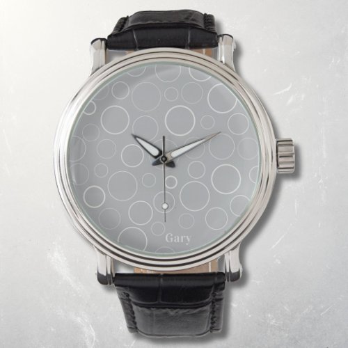 Bubbles and rings, white circles on grey watch