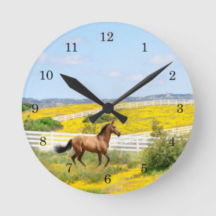 Buckskin Horse Running in Field of Flowers Round Clock