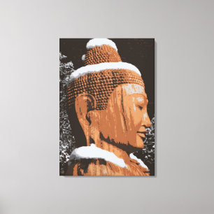 buddha in snow wrapped canvas print