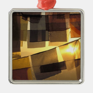 Buddhist prayer flags in the sunset, metal ornament