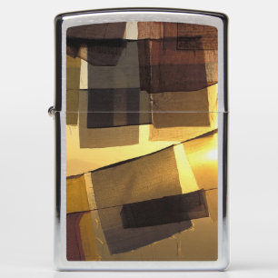 Buddhist prayer flags in the sunset, zippo lighter