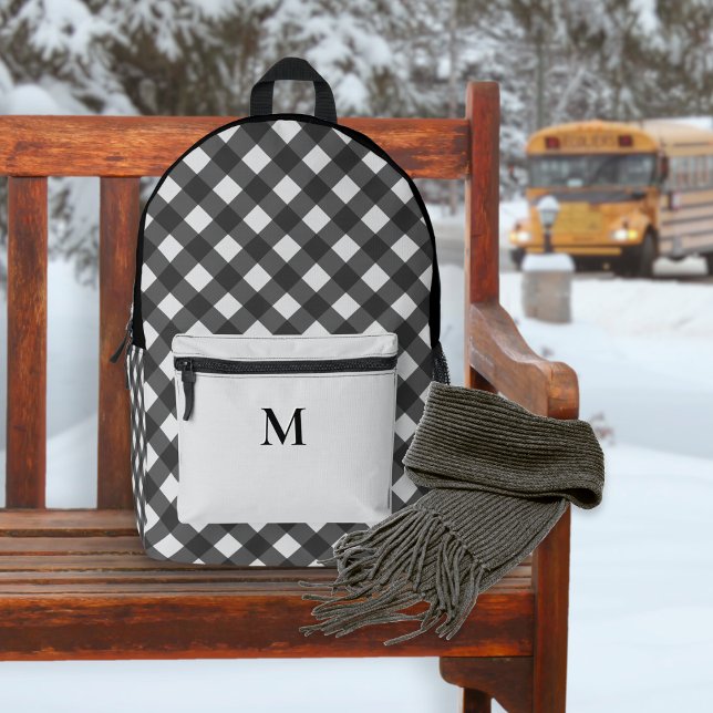 Buffalo Plaid Black and Gray Pattern Monogrammed Printed Backpack (A backpack with black and white buffalo check pattern and monogrammed silver-gray front pocket)