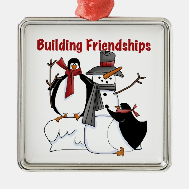 Building Friendships Holidays Snowman Penguins Metal Ornament (Front)