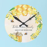 Bumble bees honey yellow florals family monogram round clock<br><div class="desc">Cute bumble bees,  yellow florals,  and dripping honey from honeycomb. Personalize and add your name and the name of your summer vacation home,  cottage.</div>