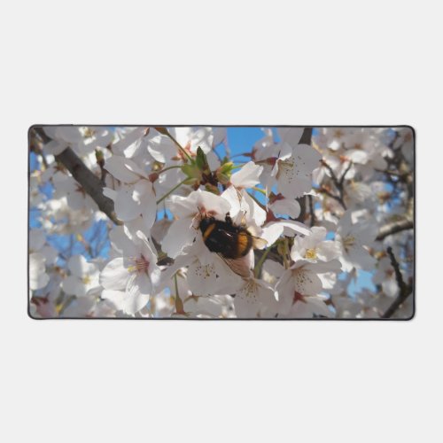 Bumblebee on wild cherry bloom desk mat