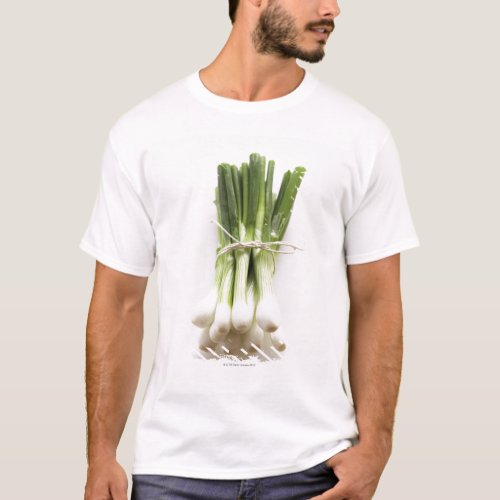 Bunch of spring onions on white chopping board T_Shirt