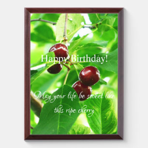 Bunches of cherries on a background of green folia award plaque