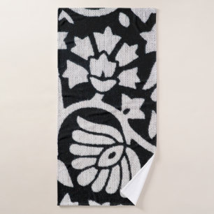 Bunches of plants and flowers abstract on a black bath towel
