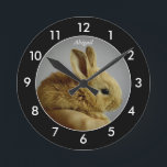 Bunny Rabbit Personalized Black Border Round Clock<br><div class="desc">Baby bunny rabbit in the palm of a hand personalized black rimmed with white numbers clock.</div>