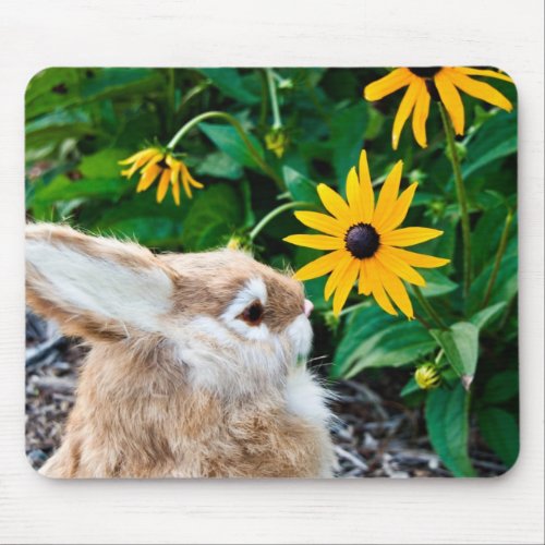 bunny sniffing flower mouse pad
