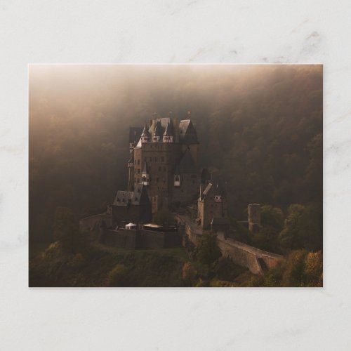 Burg Eltz castle in the morning fog Postcard