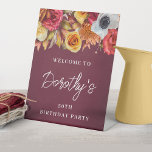 Burgundy Fall Flowers 50th Birthday Party Welcome Pedestal Sign<br><div class="desc">Welcome your guests in style with this fall welcome sign. A lush border of fall flowers is placed across the top and it pops against the burgundy watercolor background. Three lines of bright white text let you customize your birthday party welcome. This item is part of the Burgundy Fall Flowers...</div>