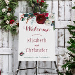 Burgundy floral winter wedding welcome sign<br><div class="desc">Rustic chic wedding sign foam board with red burgundy and white peonies and winter seasonal fir branches, red berries, and foliage and with custom script lettering on white background Please note that the background color is editable. You can change it, as well as the lettering fonts and color, after selecting...</div>