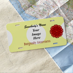 Burgundy Flower Ribbon by Kenneth Yoncich License Plate